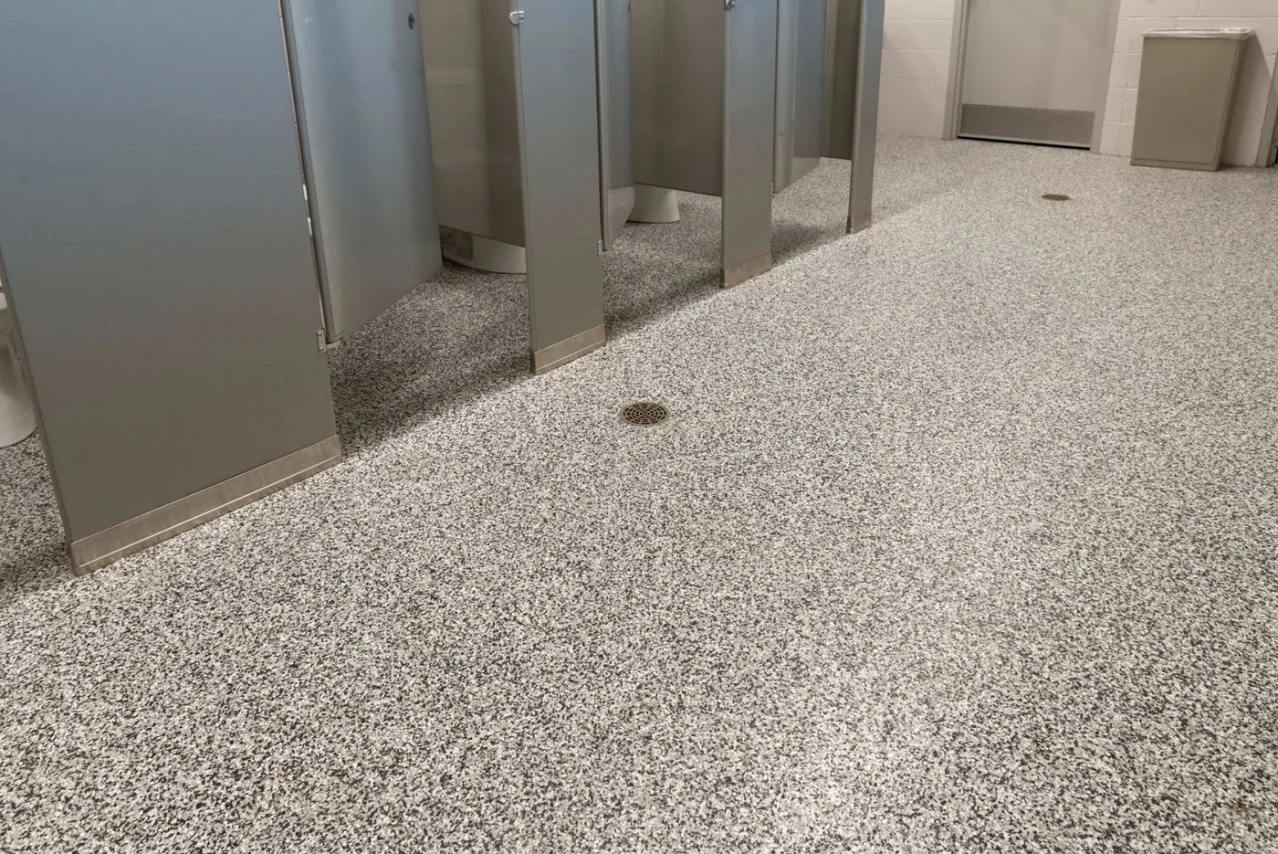 Gray flake floor in a commercial restroom