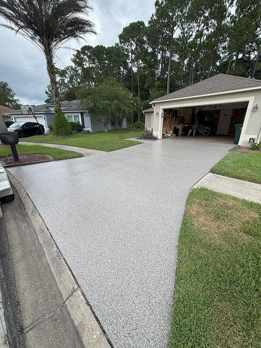 Light gray flake coating on a driveway
