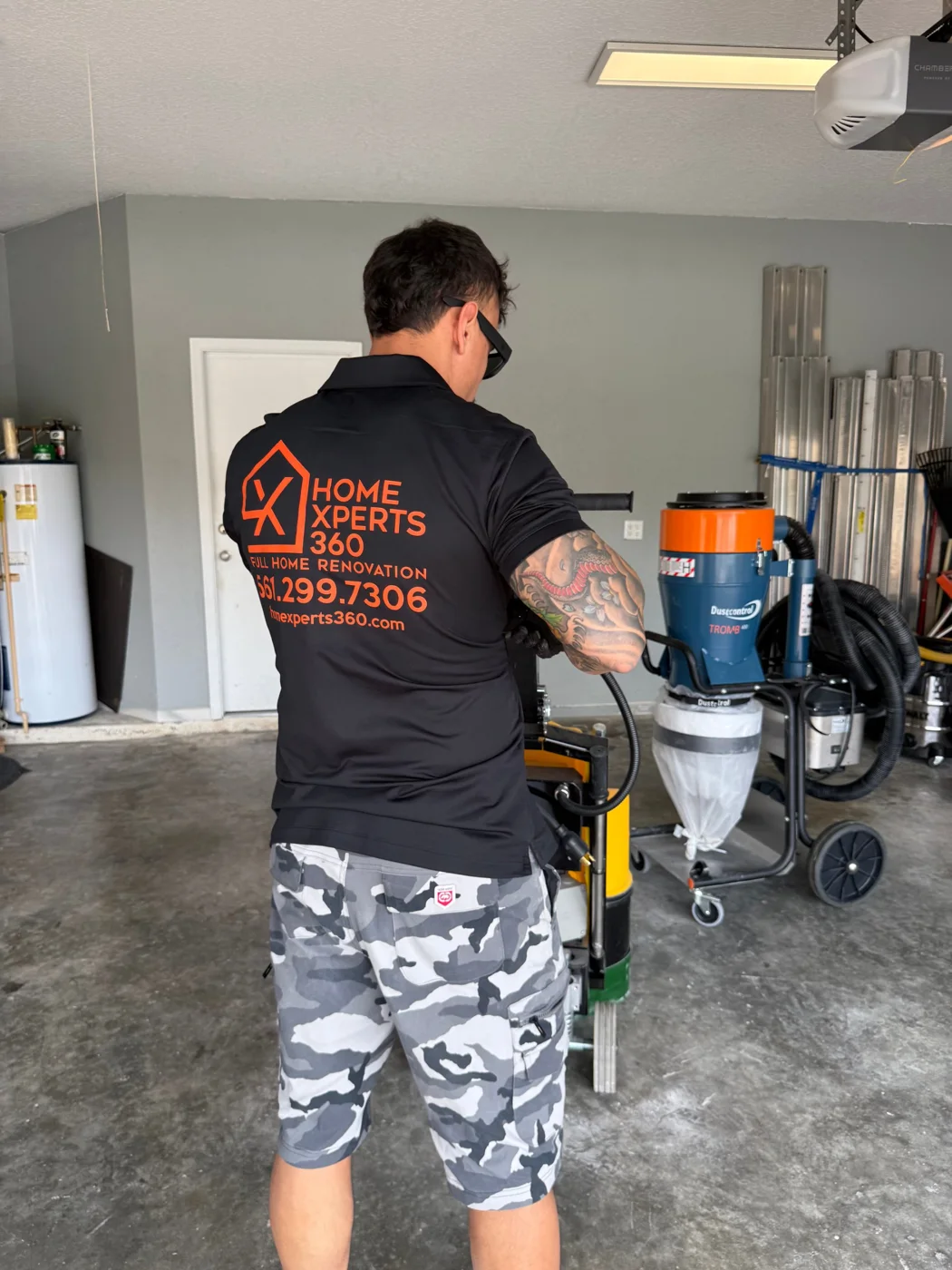 Home Xperts 360 installer running a floor grinder
