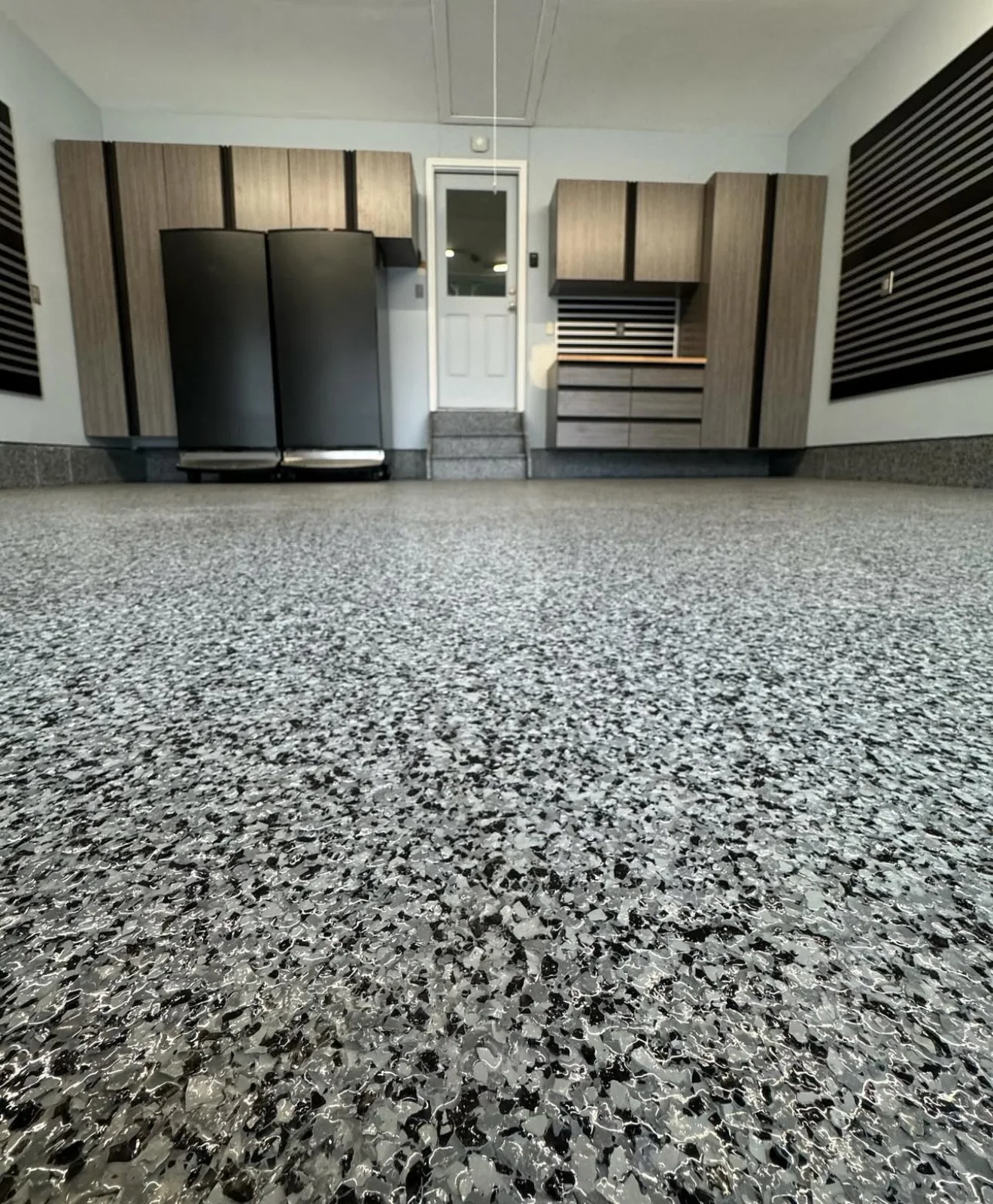 Epoxy and polyaspartic garage floor coating installation in Boca Raton