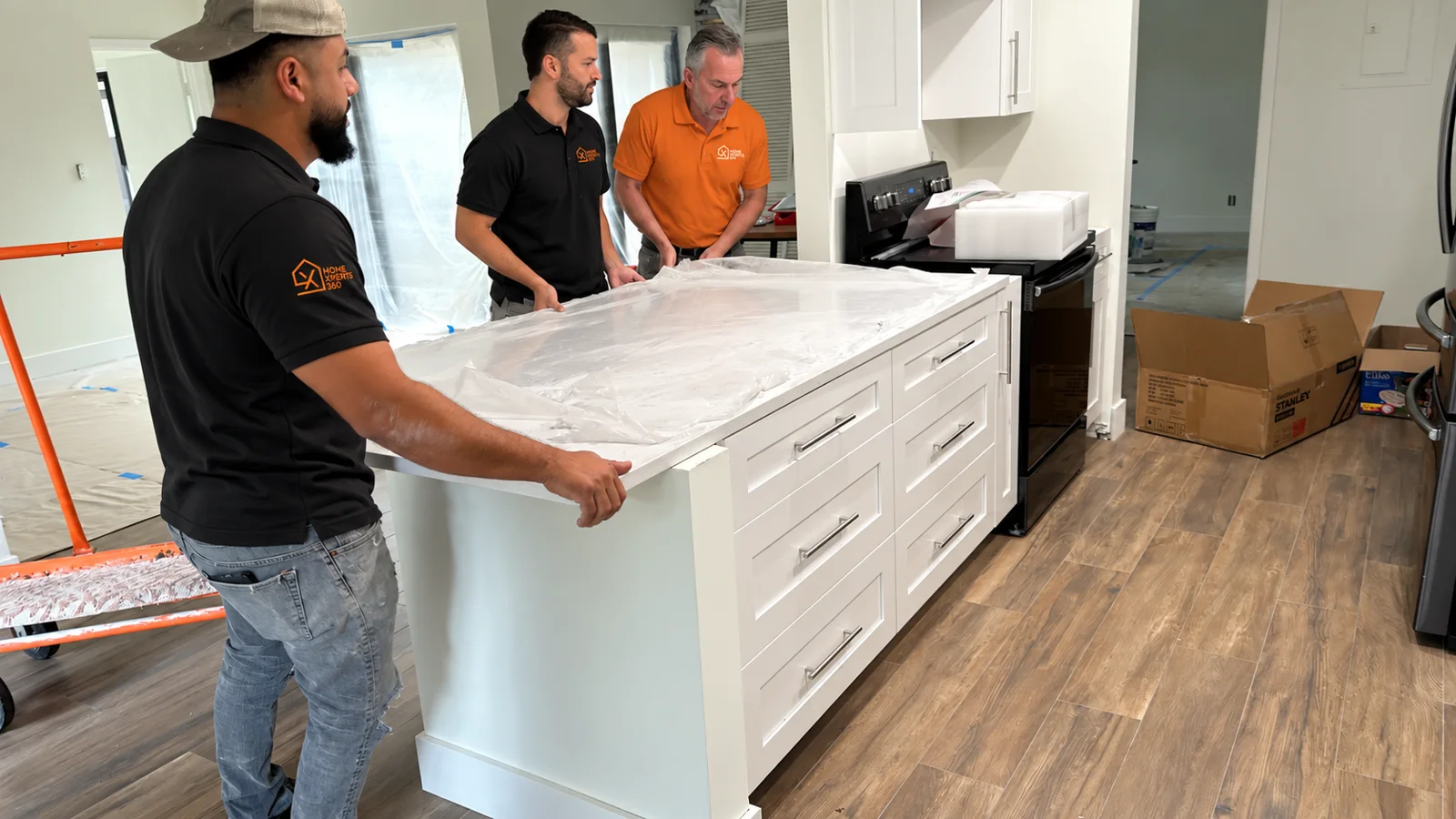 Crew installing a countertop on a shaker island