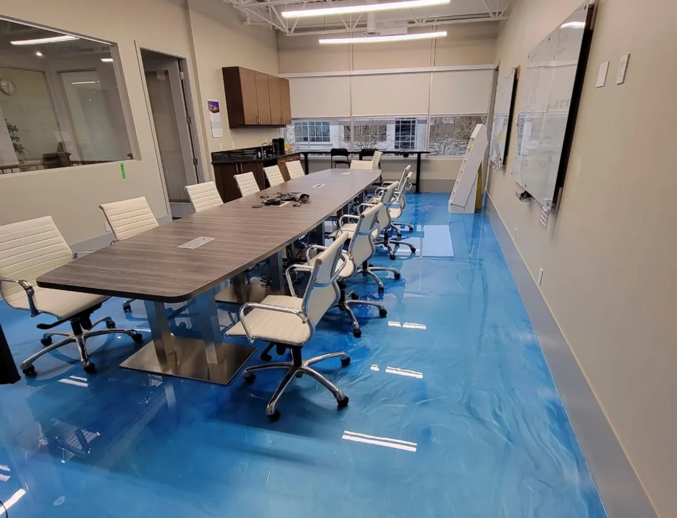 Blue metallic epoxy floor in an office conference room