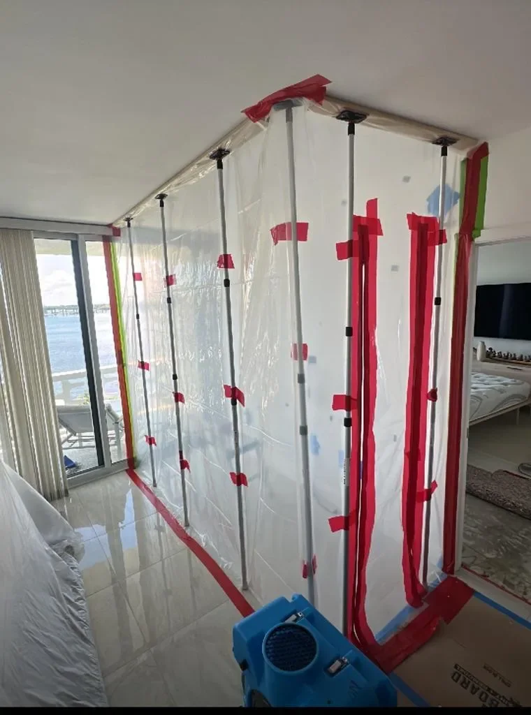 Plastic containment set up inside a condo