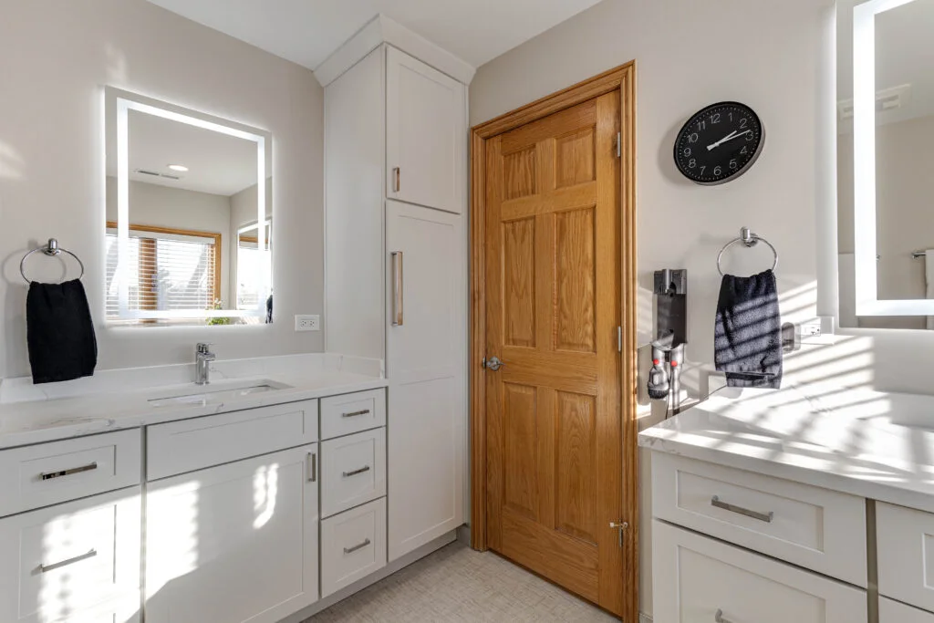 White shaker vanity with tall linen cabinet